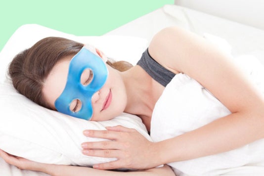 Woman wearing a Plemo Spa Eye Mask while sleeping.